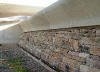 Gabions of stone from former brewery building on site